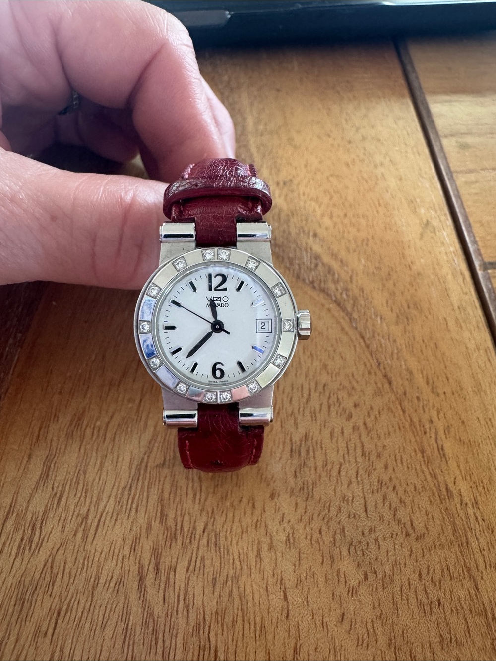 VZO Movado Ladies Watch w/ Diamond Bezel. Red leather strap. Pristine condition.